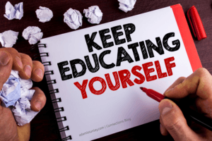 Conceptual hand writing showing Keep Education Yourself. Business photo text never stop learning to be better Improve encourage written by Man Notepad wooden background Marker Paper Balls